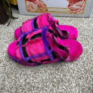 UGG Pink and Purple Fuzzy Slippers size is missing fit like 8